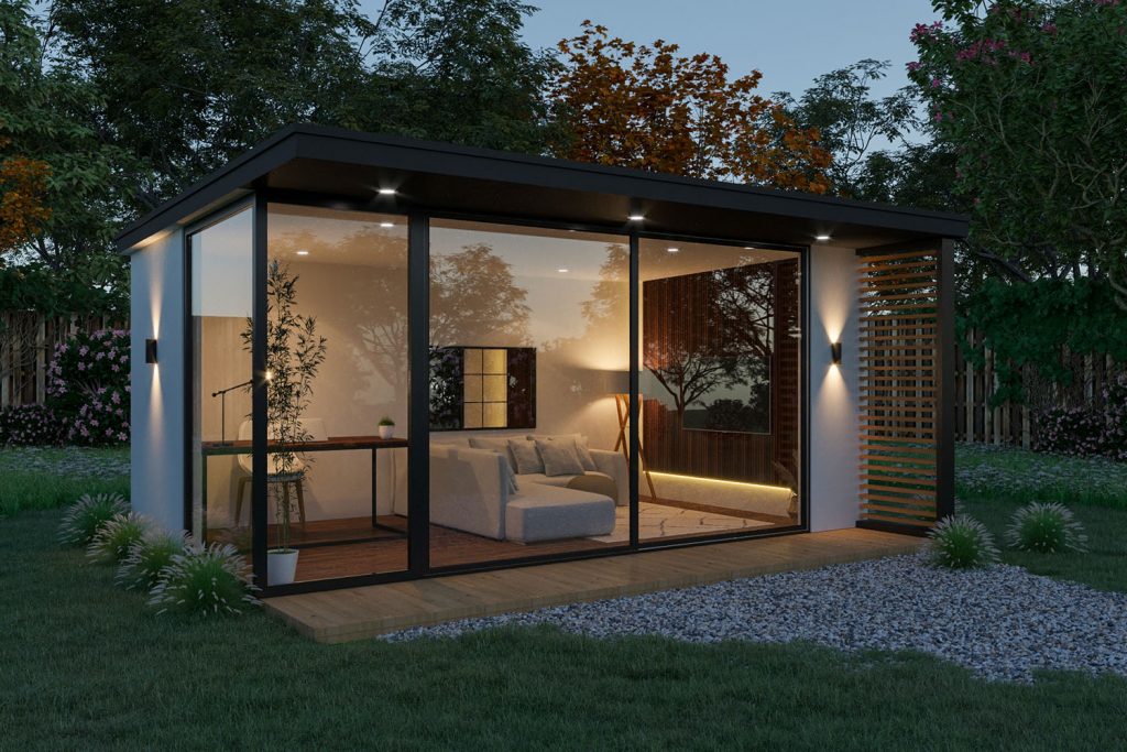 night time picture of a modern garden room white rendered walls