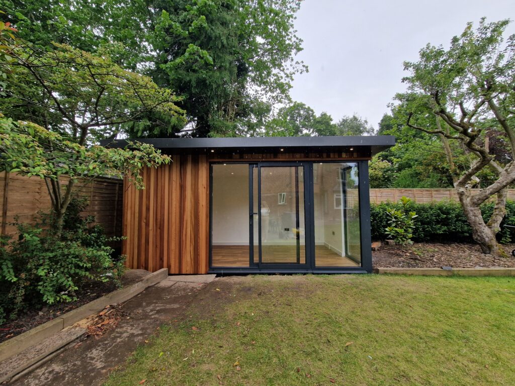 Cedar gym studio, with aluminium slider and corner window.