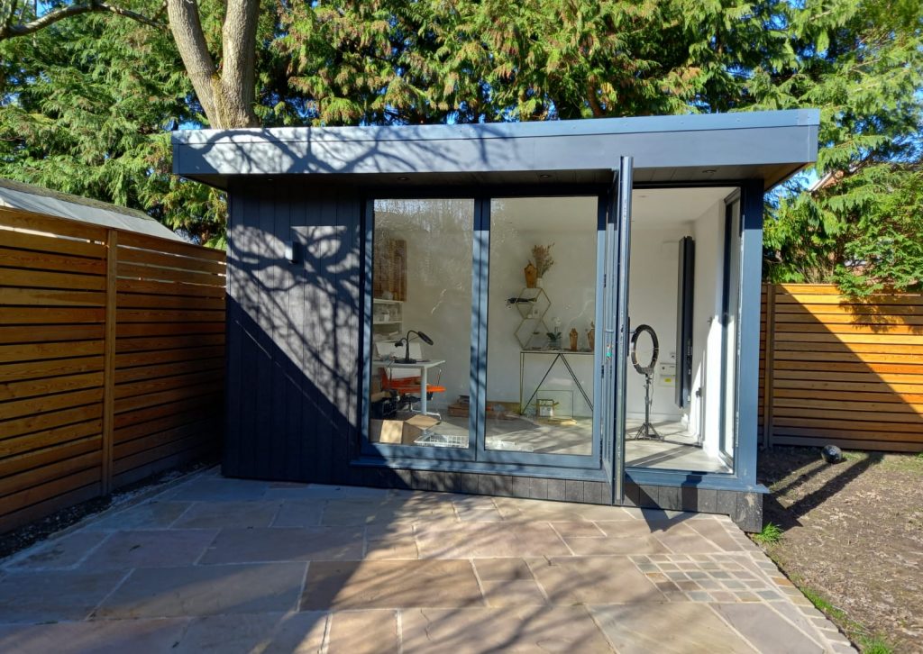 Composite office studio with aluminium bi folding door.